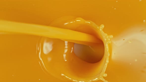 Super Slow Motion Shot of Pouring Orange Juice at 1000Fps alt