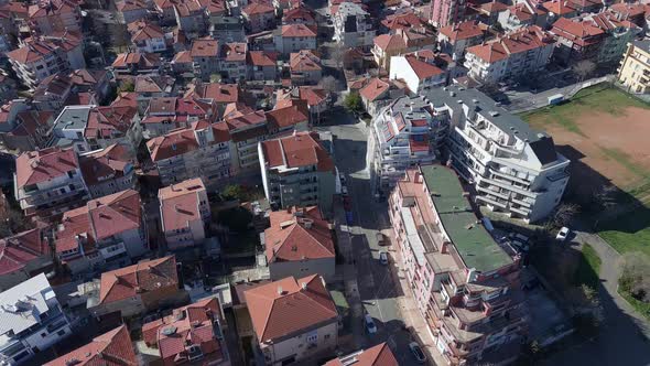 View From a Height of the City of Pomorie with Many Cars Houses and Hotels alt
