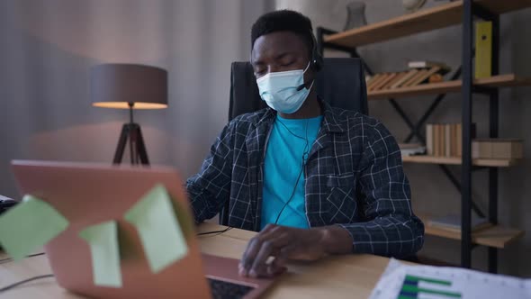 Serious African American Male CEO in Covid19 Face Mask and Pajamas Shaking Head Yes Permission for alt