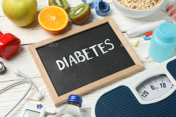Word Diabetes and diabetic accessories on wooden background - Stock Photo - Images