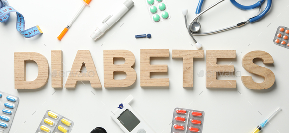 Word Diabetes made of wooden letters on white  background. Diabetes accessories - Stock Photo - Images
