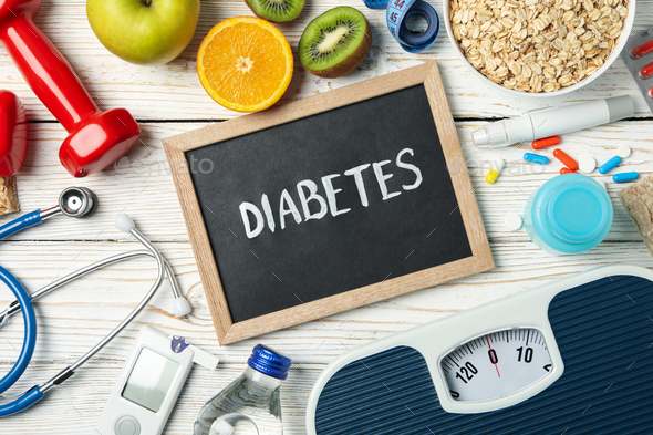 Word Diabetes and diabetic accessories on wooden background - Stock Photo - Images