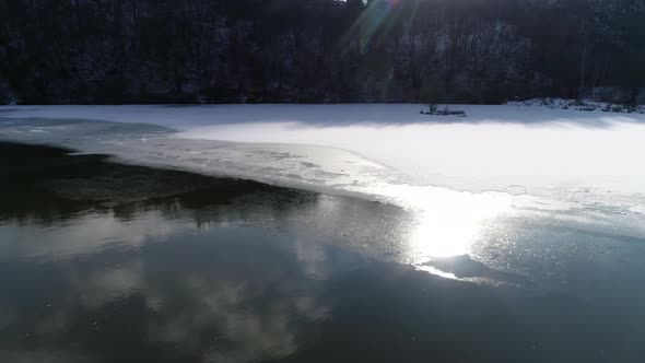 River in Winter with Sun Reflection 4K