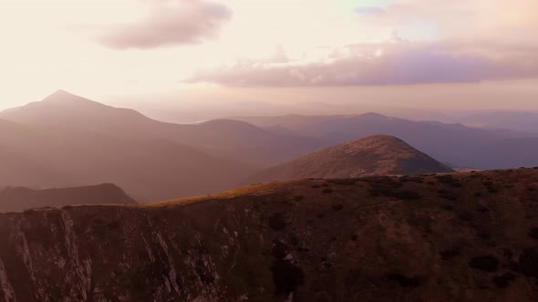 Mountain Ranges Under Sunset Sky alt