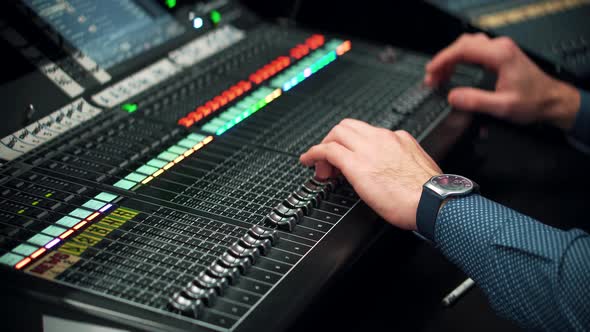 Sound Engineer Moving Sliders In Radio Station.Sound Designer Used Digital Audio Mixer In Production alt