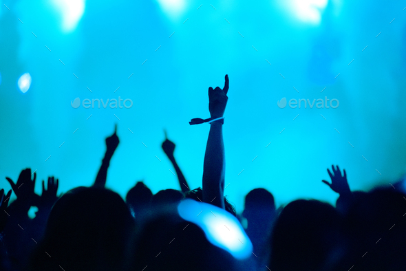 Rear View Of Silhouette Of Crowd With Arms Outstretched At Concert Summer Music Festival Concept Stock Photo By Salajean