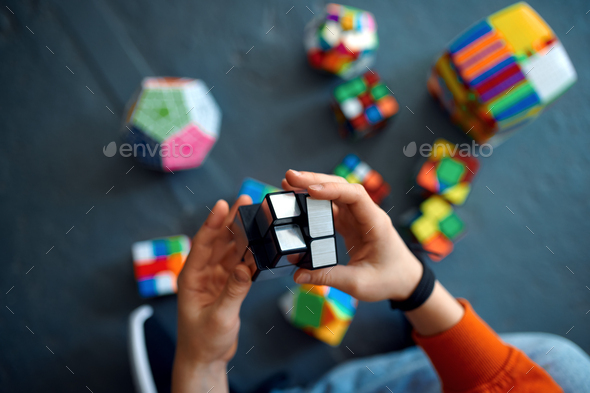 Male child play with puzzle cubes
