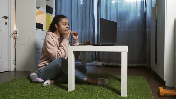 Eating Sandwich In Front Of Laptop