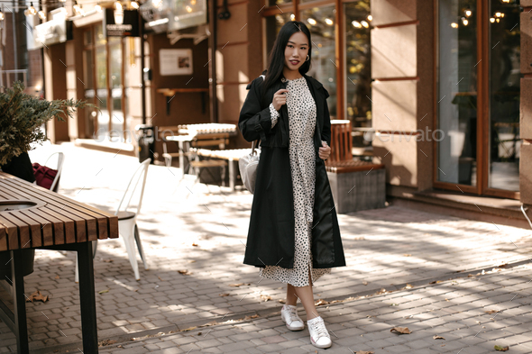 Portrait Of Brunette Asian Woman, Black Trench Coat White Dress