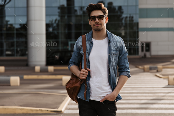 Handsome and fashionable indian man in black jeans jacket posed outdoor.  10513949 Stock Photo at Vecteezy