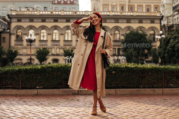 Charming Brunette Asian Woman In Midi, Beige Trench Coat Dress