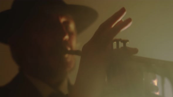 Closeup of Musician Playing Jazz on Trumpet in Club Front View alt