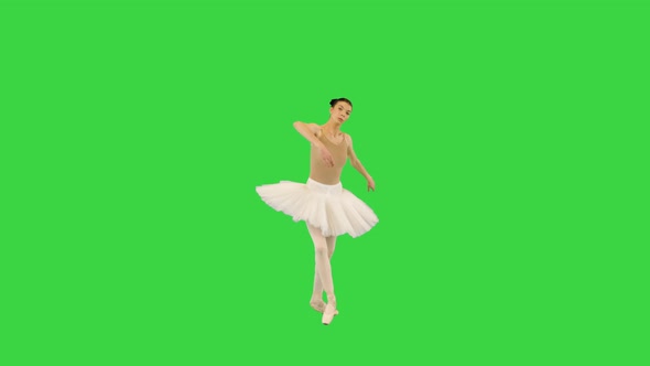 Young Ballerina Performing Some Ballet Movements on a Green Screen Chroma Key alt