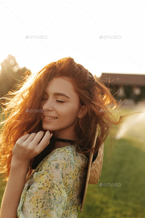 Ginger Haired Girl With Lovely Freckles And Trendy Straw Hat In Stylish Summer Light Dress
