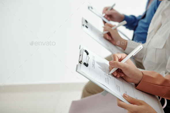 Business people filling curriculum vitae forms - Stock Photo - Images