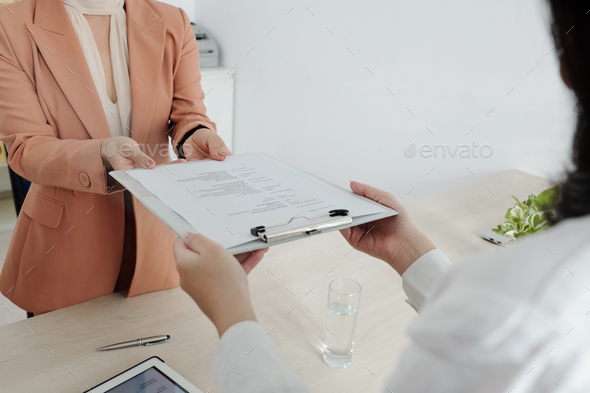 Job applicant giving cv document - Stock Photo - Images