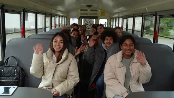 Joyful Multiracial Students Posing on School Bus alt