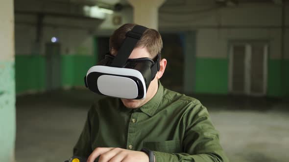 Modern Engineer Wearing Virtual Reality Glasses Puts a Helmet on His Head