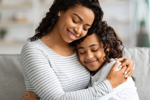 Closeup portrait of hugging african american mother and daughter Stock ...