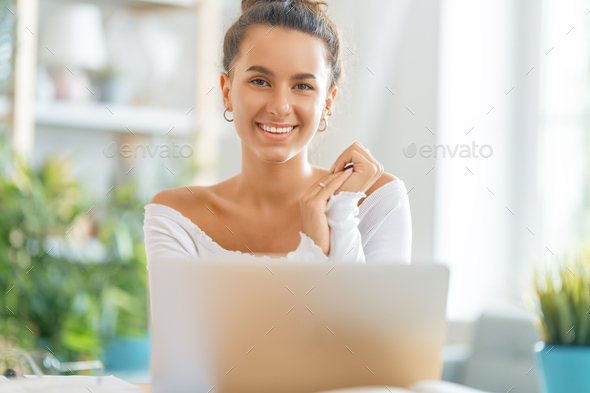 woman working on laptop at home - Stock Photo - Images
