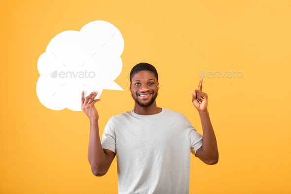 I have creative idea. Inspired african american guy holding an empty speech bubble above his head