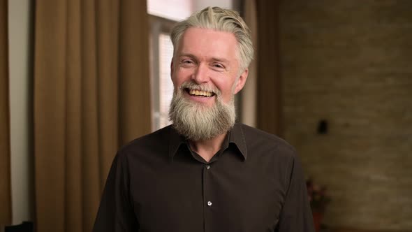 Emotion of embarrassment and embarrassment shown by a gray-haired adult man alt