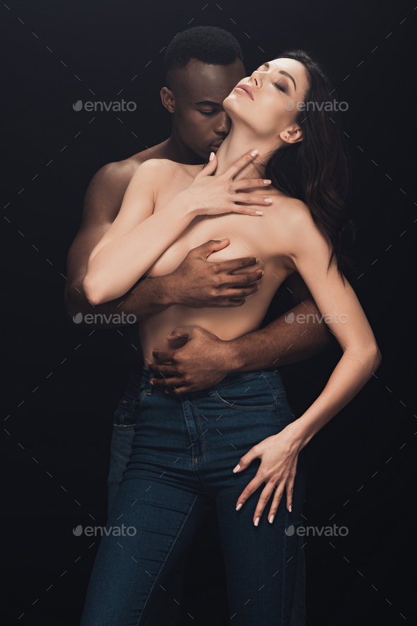 Beautiful Black Couples Nude - beautiful half-naked interracial couple passionately embracing isolated on  black Stock Photo by LightFieldStudios