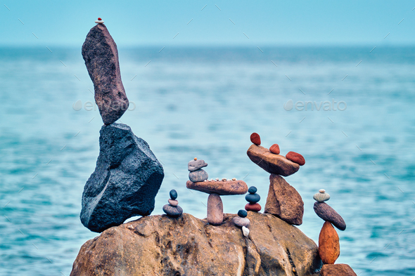 Concept of balance and harmony - pebble stone stacks on the beach - Stock Photo - Images