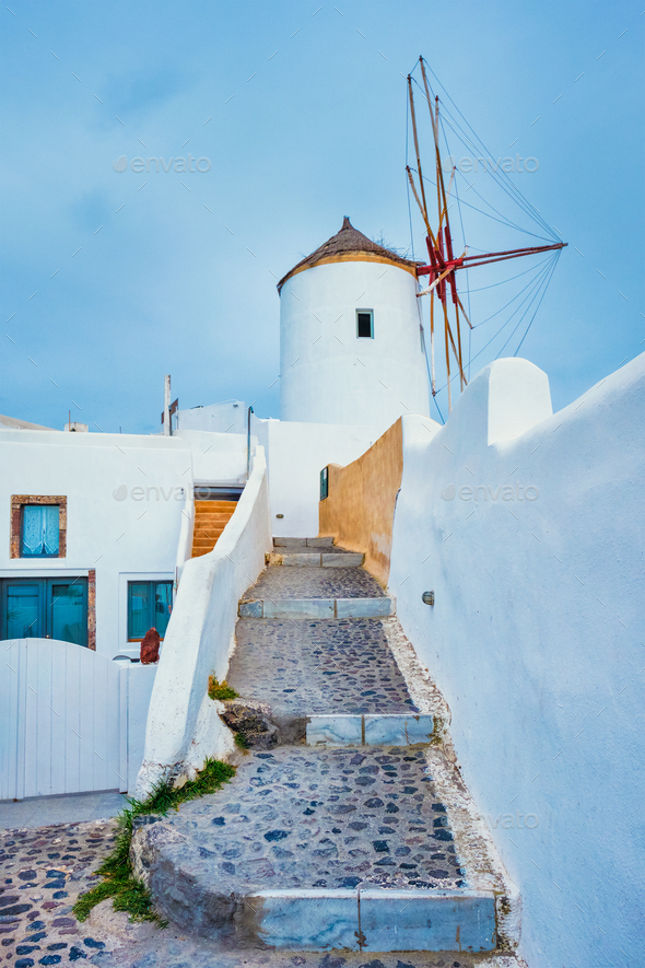 Old greek windmill on Santorini island in Oia town with stairs in street. Santorini, Greece - Stock Photo - Images