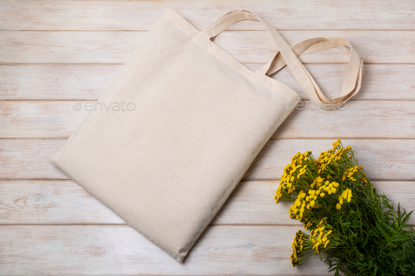 Download Rustic Tote Bag Mockup With Yellow Wildflowers Stock Photo By Tasipas
