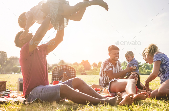 Happy families doing picnic in nature park outdoor - Stock Photo - Images