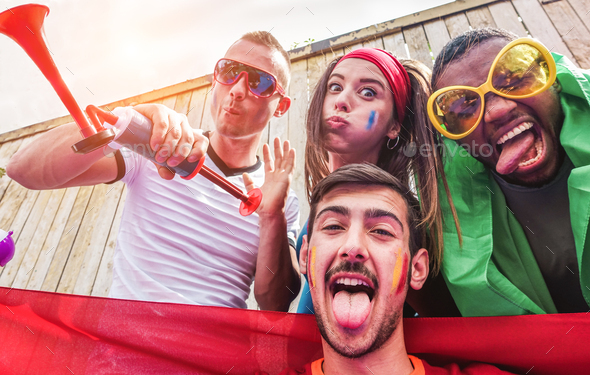 Happy sport supporters having fun during football world game - Stock Photo - Images