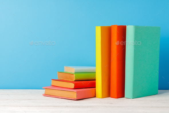 blue and orange book stack