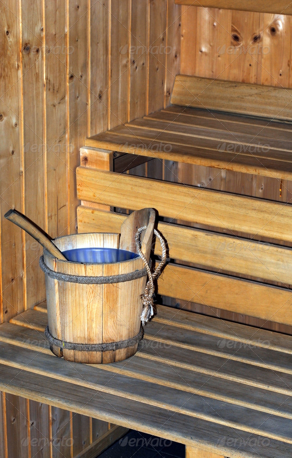 wooden bucket full of water in a sauna