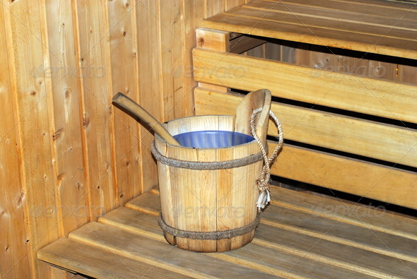 wooden bucket full of water in a sauna