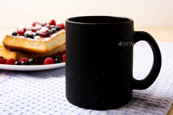 Black coffee mug mockup with waffles and berries - Stock Photo - Images