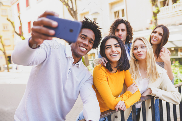 friends with smartphone taking selfie in club, Stock image