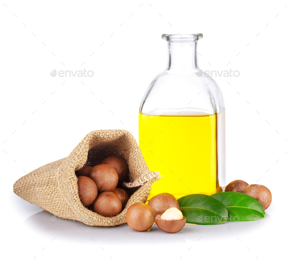 Australian macadamia nuts with leaves and nut oil - Stock Photo - Images