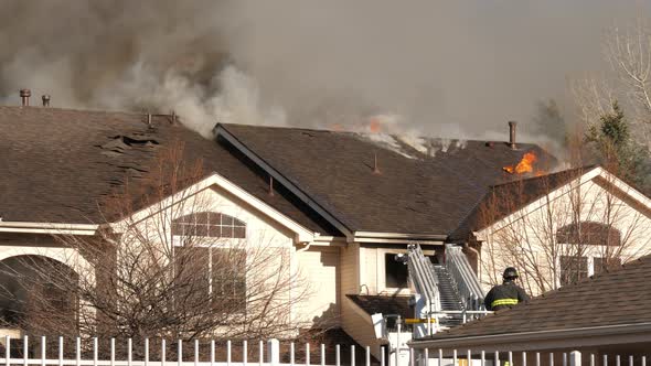 Condo Fire Zoom in on Burning Roof alt