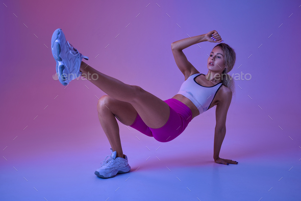 Sexy sportswoman doing fit exercise in studio - Stock Photo - Images