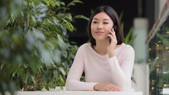 Asian Friendly Talking Girl Sitting in Cafe Korean Japanese Chinese 20s Woman Remote Speaking with alt