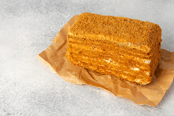 Piece of honey cake on kitchen table