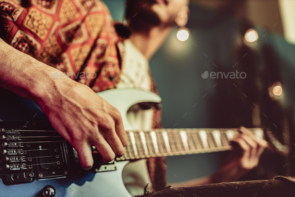 Close Up Of Male Hand Playing Electric Guitar In The Dark Stock Photo By Fabrikaphoto