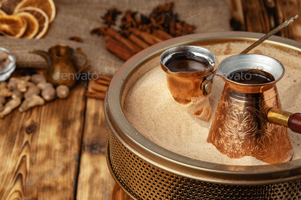 Process of preparation of coffee in turk in cezve on sand - Stock Photo - Images