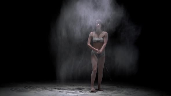 Beautiful Girl Throwing Dust Video in the Dark