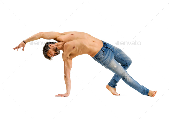 Middle-aged athletic fit man doing mobility exercises