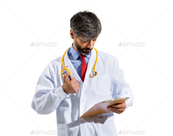 Doctor consulting patient records or notes on a clipboard - Stock Photo - Images