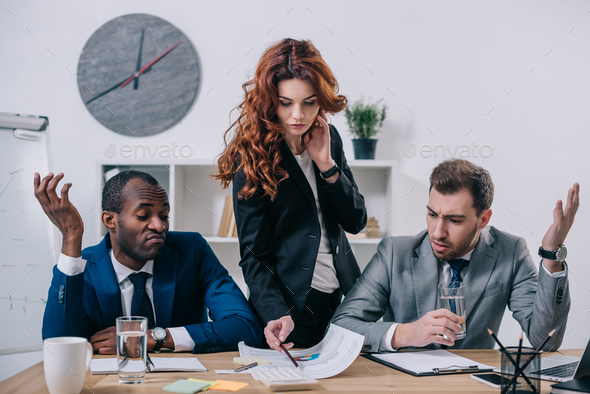 Interracial businesspeople having discussion in modern office Stock Photo  by LightFieldStudios