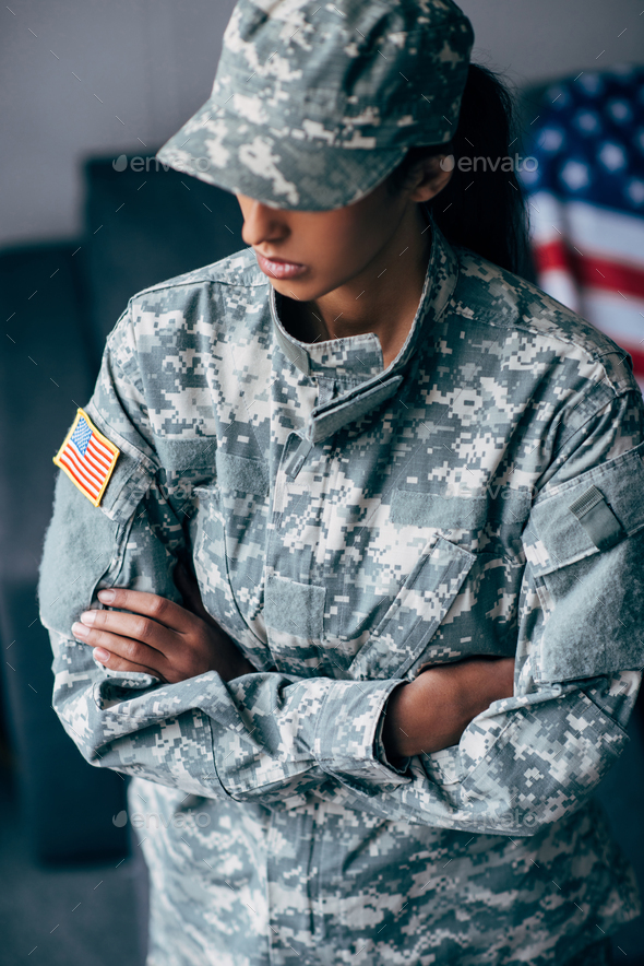 african american female soldier in military uniform with usa flag emblem