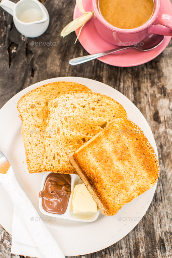 Perfect breakfast. Toast with butter and chocolate paste